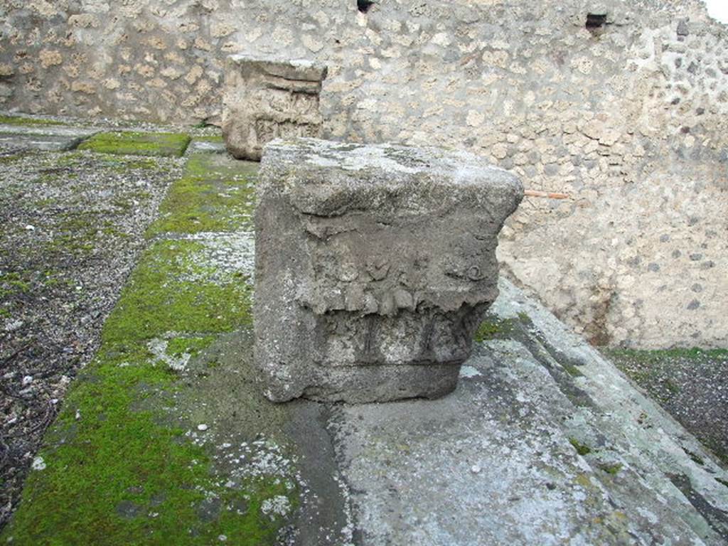 VIII.7.25 Pompeii. December 2006.   Capitals on podium.