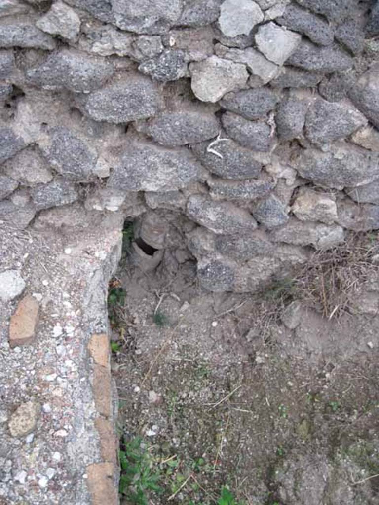 VIII.7.26 Pompeii. October 2010. North east corner of upper part of VIII.7.26 garden (north portico to left of image). Detail of terracotta pipe in partition wall with VIII.7.24. Photo and information courtesy of Drew Baker/Gareth Beale/Hembo Pagi