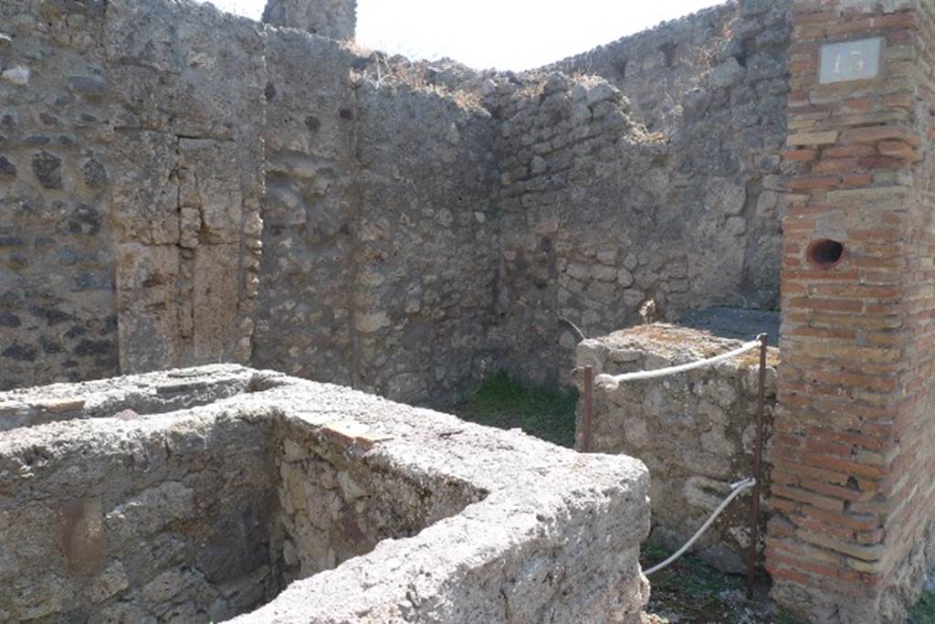 IX.1.13 Pompeii. July 2010. Looking south-east across counter. Photo courtesy of Michael Binns. A few small plaster fragments of Opus signinum were preserved here and there on the walls. See Gallo, A: L�insula I della Regione IX, Settore Occidentale, in Studi della Soprintendenza archeologica di Pompei, no. I, 2001, (p.53)
