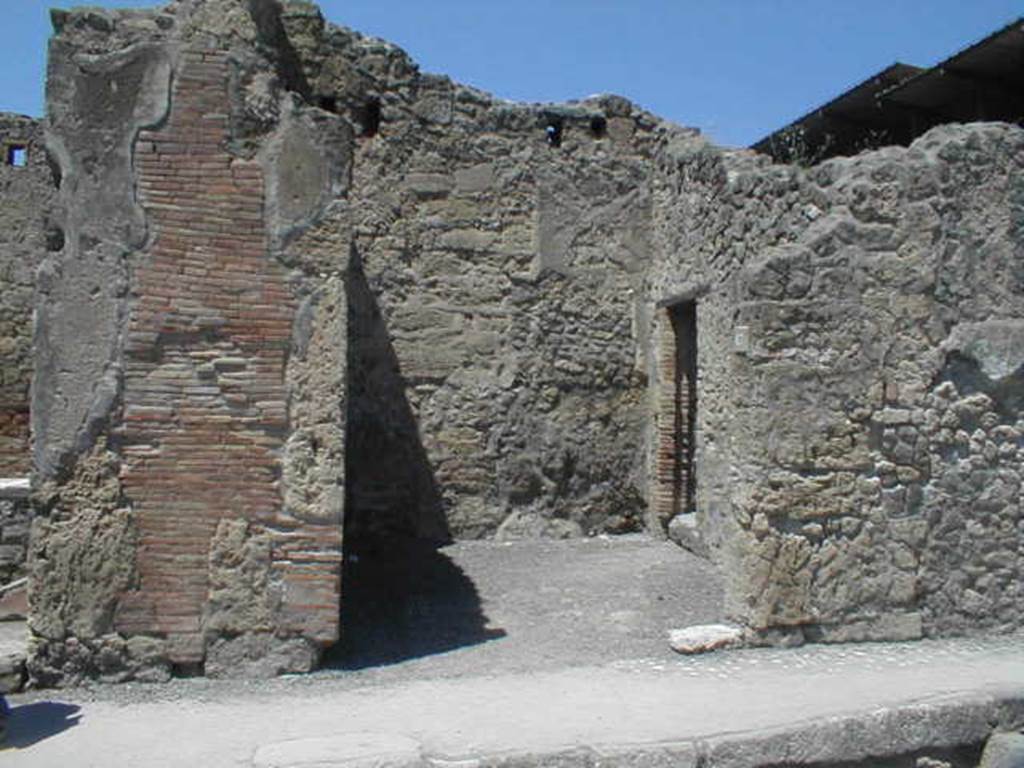 IX.1.17 Pompeii. May 2005. Entrance on Via dell�Abbondanza. Looking north. The doorway in the east wall, on the right, leads into IX.1.18. For graffiti found on the left pilaster, between IX.1.16 and 17, see IX.1.16.  The following graffiti was found in March 1858, on the pilaster between IX.1.17and IX.1.18 (on the right)

C(aium)  Vestorium   [CIL IV 1051]

Lollium
aed(ilem)  o(ro)  v(os)  f(aciatis) d(ignum)  r(ei)  p(ublicae)   [CIL IV 1052]

Polybium
II vir(um)  Lollia
cum  suis    [CIL IV 1053]

Priscum  [CIL IV 1054]

L(ucium)  Ceium  Firmum  o(ro)  v(os)  f(aciatis)  d(ignum)  r(ei)  p(ublicae)   [CIL IV 1055]

See Pagano, M. and Prisciandaro, R., 2006. Studio sulle provenienze degli oggetti rinvenuti negli scavi borbonici del regno di Napoli..  Naples : Nicola Longobardi. (p.175) 
