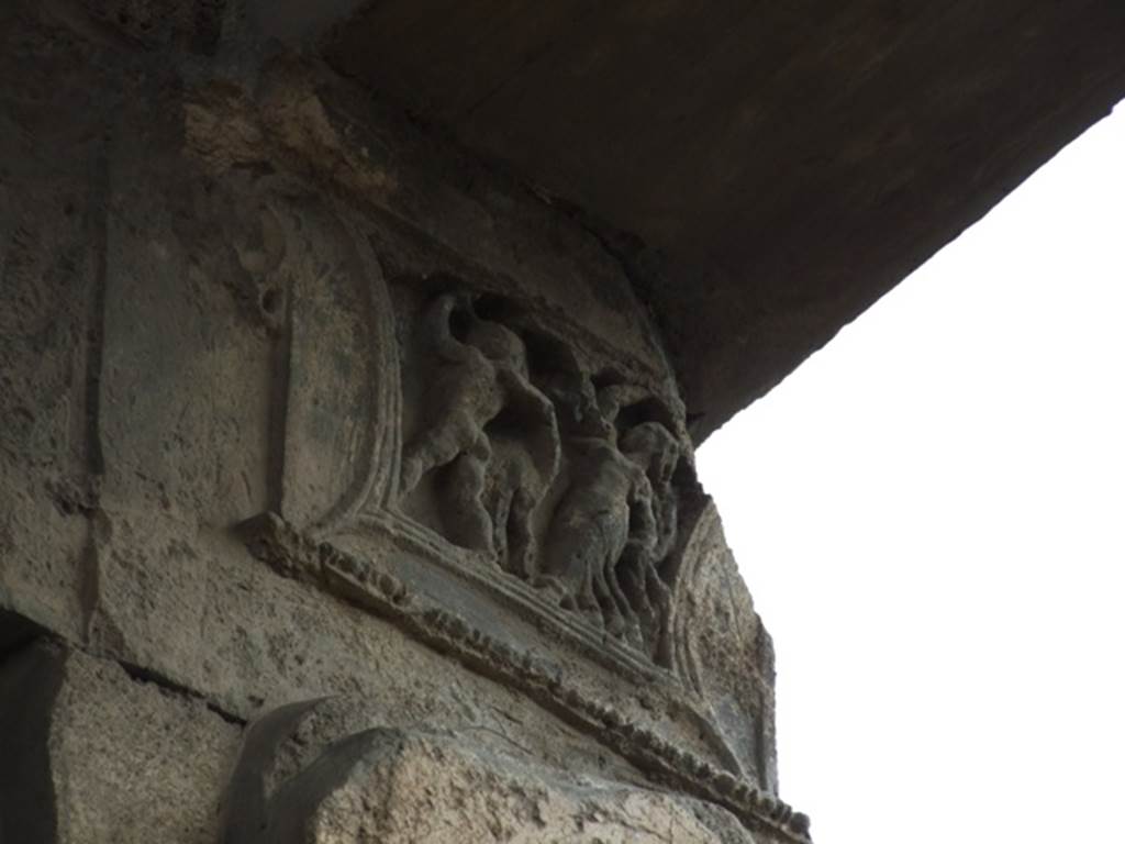 IX.1.20 Pompeii.  December 2007.  Room 2.  Atrium, West Side.  Figured capital from north western corner consisting of a full figure relief of satyrs and bacchantes.
