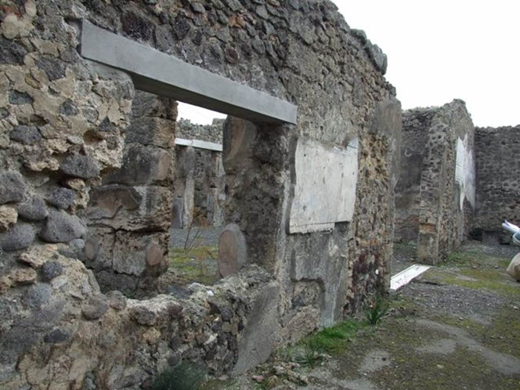 IX.1.22 House of M. Epidi Sabini. December 2007. Room 24. Second peristyle. Looking south along east wall of peristyle and through window of room 28.