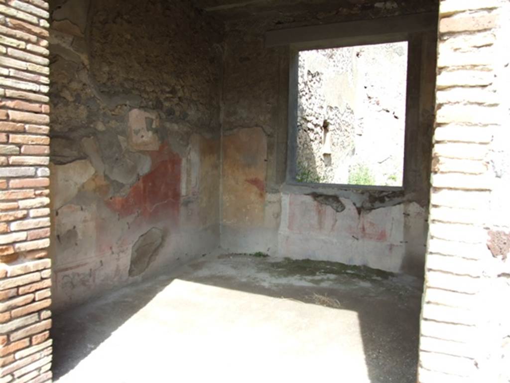 IX.2.5 Pompeii. March 2009. Doorway to triclinium, looking towards north-east corner, and window to garden in east wall. In this room, the zoccolo would have been black, the central panel on the walls was red, the side panels were yellow. According to Sogliano, the paintings found in this room were � Ariadne abandoned (p.97, no.535), A bust of Paris wearing a green heat, with cupid on his right shoulder (p.105, no.558), A bust of Helen, turning to the left, in response to no.558, faded and vanishing (p.108, no.567), Cimone and Perona (p.121, no.599) now in Naples Museum, inv. no: 115398.
See Sogliano, A., 1879. Le pitture murali campane scoverte negli anni 1867-79. Napoli: Giannini. 


