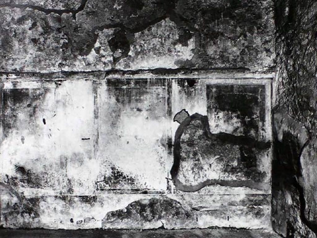 IX.2.10 Pompeii. Old undated photo of south wall of cubiculum on south side of peristyle.
The central panel was azure blue with the painting of Galatea and Polyphemus.
A naked Galatea, is seen from her shoulders, embracing and joining to Polyphemus, who is sitting on a rock.
