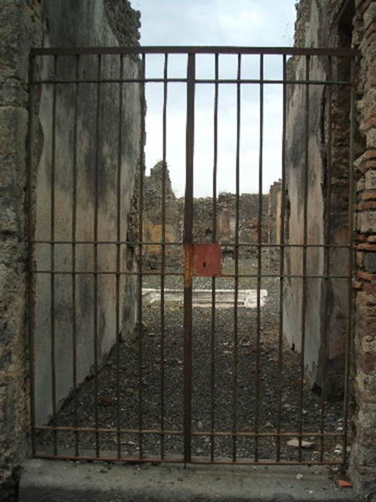 IX.2.18 Pompeii. September 2004. Entrance. Graffito found on the right side of the entrance, between IX.2.18 and IX.2.19, read:

P . PAQVIVM . PROCVLVM . II . VIR . I . D .
                 MARCELLVS . ROG     [CIL IV 3622]

and underneath it, the name:

M  FANIVS  RVFVS

See Pappalardo, U., 2001. La Descrizione di Pompei per Giuseppe Fiorelli (1875). Napoli: Massa Editore. (p.143)

According to Della Corte, there were three electoral recommendations written to the side of the entrance:
Vettium  et  Ovidium  (Curv)ius  iuvenis  facit      [CIL IV 3618]       
Curvius  rog(at)     [CIL IV 3619]
P(ublium)  Paquium  Proculum  II vir(um)  i(ure)  d(icundo)  Marcellus  rog(at)     [CIL IV 3622]            
See Della Corte, M., 1965.  Case ed Abitanti di Pompei. Napoli: Fausto Fiorentino. (p.211)

