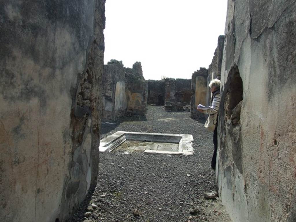 IX.2.18 Pompeii. March 2009.  Looking west along entrance corridor to atrium, Room 1.