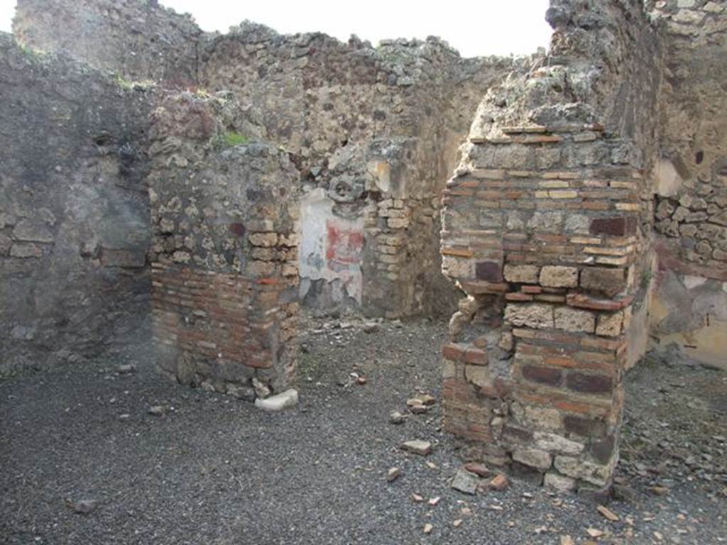 IX.2.21 Pompeii. March 2009. Doorways to rooms 13 and 14, from north portico.  According to Boyce, in these two cubicula many objects were found including jewellery and four bronze statuettes:
One was �Abbondanza� holding a cornucopia in the left hand and a patera in the right � probably the Genius -
and Minerva, helmeted and holding a spear in the right hand, and a shield on the left arm.
Also found were the two Lares, each holding rhyton and patera.
See Boyce G. K., 1937. Corpus of the Lararia of Pompeii. Rome: MAAR 14. (p.81)
Boyce�s reference was given as Giorn. Scavi, N.S., ii, 1872, 281. 
