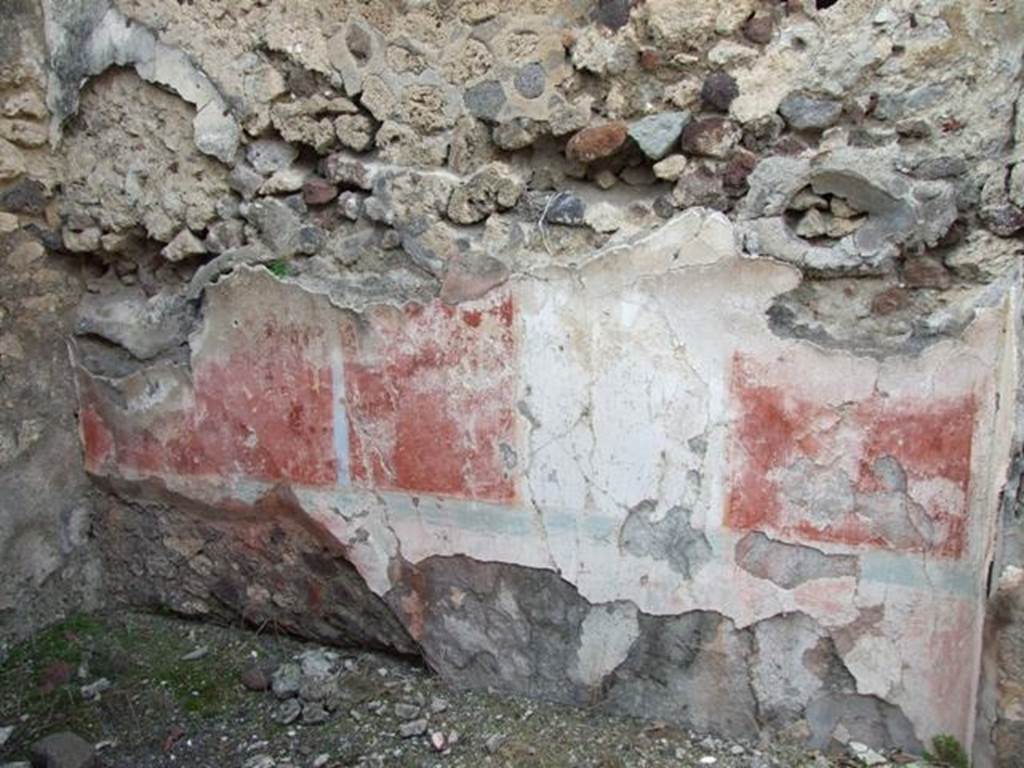 IX.2.21 Pompeii. March 2009. Room 13, north wall of cubiculum. According to Bragantini, the dado would have been red, and in the middle zone of the north wall was a white central aedicula. On both sides of it, the panels were red. The upper zone of the wall would have been white. The panel on the west end was sub-divided by a candelabra which formed the recess wall. At the base of the middle zone was an azure blue line. In the white panel, a painted female figure near an archaic herm of Dionysus, was seen.
See Sogliano, A., 1879. Le pitture murali campane scoverte negli anni 1867-79. Napoli: Giannini. (p.52, no.243) 
See Bragantini, de Vos, Badoni, 1986. Pitture e Pavimenti di Pompei, Parte 3. Rome: ICCD. (p.424, cubicolo �m�)
