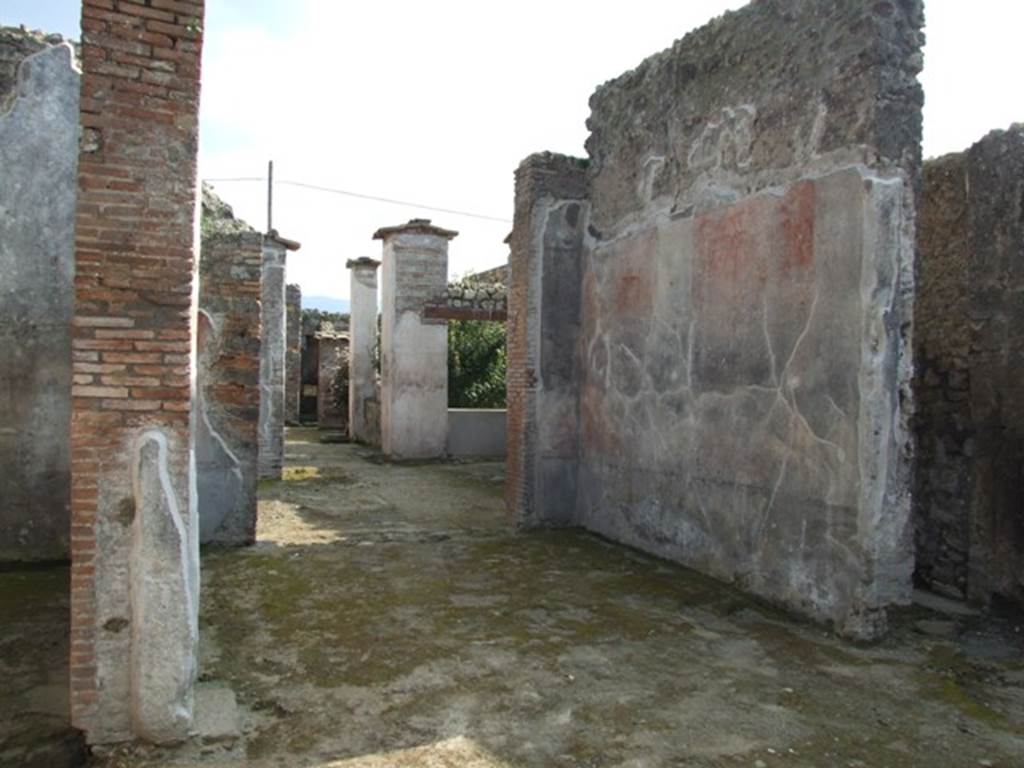 IX.3.5 Pompeii. March 2009. Room 32, west wall of tablinum. The west wall would have been painted with a black dado. In the middle zone, the narrow central compartment would have had a white background. The bordered side panels were probably red and yellow.
At the north end was a red panel, and decoration of candelabra could be seen.
See Bragantini, de Vos, Badoni, 1986. Pitture e Pavimenti di Pompei, Parte 3. Rome: ICCD. (p.444, tablino �33�)
