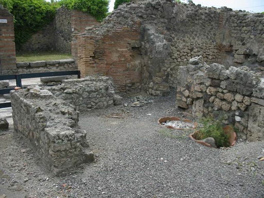 IX.3.10 Pompeii, taken from IX.3.11. May 2003. Looking north-west across bakery shop. Photo courtesy of Nicolas Monteix.