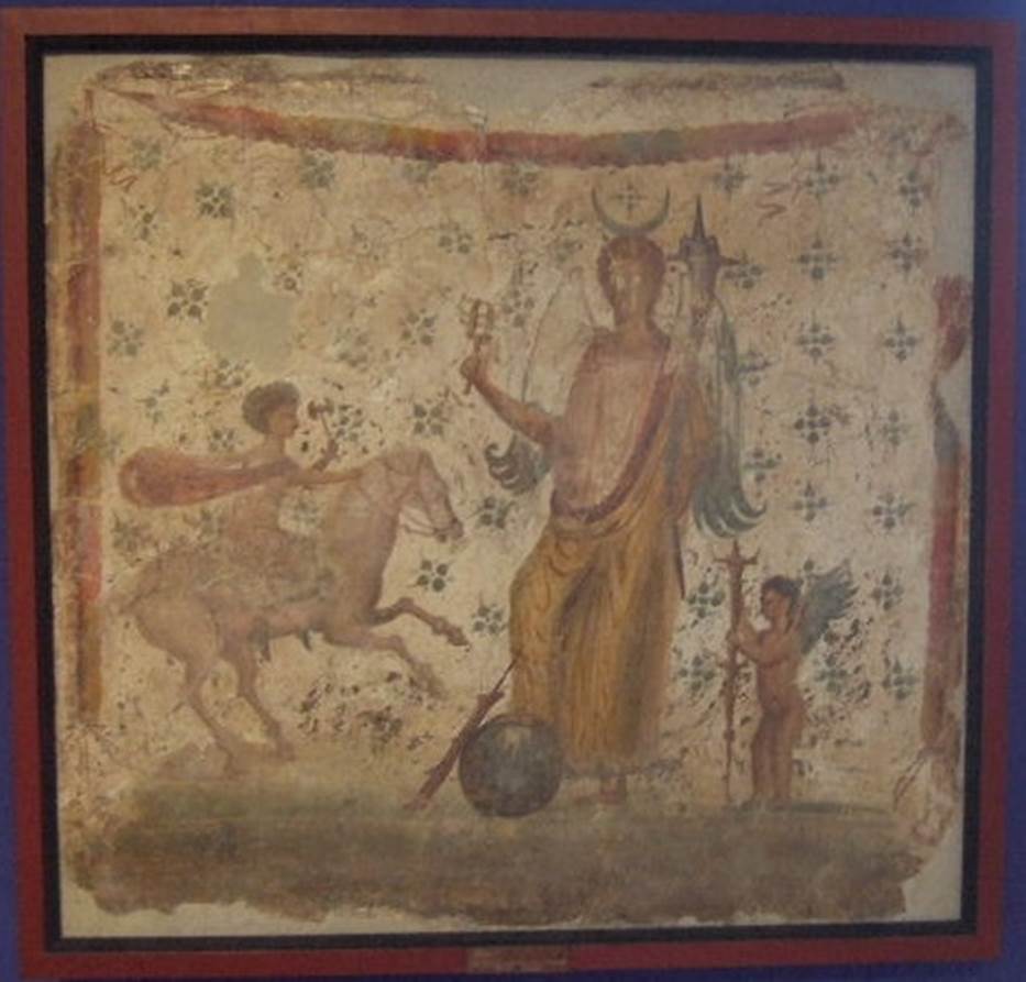 IX.3.15 Pompeii.  Picture of Isis Fortuna with horn of plenty and sistrum and with a foot on a globe.  To the right is Hesperos and left is Helios or Harpocrates - Helios. The painting of Isis-Fortuna (MN Inventory 8836) was found in 1847 in IX, iii, 15 on the north wall of a cubiculum, either room 5 or 6 on our plan, (according to PPM it was found in room 6, which is room "h" in their book).   It was discovered while carrying out supporting work on one of the walls of the Casa di Suonatrici which joined the two houses.  Our thanks to Raffaele Prisciandaro for his help in identifying the following sources:
(Casa di Philocalus; parete N del cubicolo; CIL 04, 882 (197); BAIt 1, 1862, n. 20, 1862, pp. 159 160; Panofka, BdI 1847, pp. 127-128 �nell�appoggiar una delle mura della casa delle Suonatrici si � scoperta al muro della casa accanto una pittura ��) 
Frohlich says this picture was found on the north wall of the shop IX.3.7.  See Fr�hlich, T., 1991, Lararien und Fassadenbilder in den Vesuvst�dten.  Mainz: von Zabern.  (L101: p.294).
Now in Naples Archaeological Museum, where it is shown as from IX.3.15. 

According to Boyce, above the garland at the top of the painting was a painted inscription, whose reading was long disputed.
He quoted it as published in C.I.L � PILOcaLVS  VOTVM  SOL  LIBES  MERITO.
See Boyce G. K., 1937. Corpus of the Lararia of Pompeii. Rome: MAAR 14. (p. 84, 415B) 

According to Della Corte, the owner of this house and shop at number 16, was a Philocalus. He had a sacred painting made for his bedroom and had the following dedication painted on it in his name:
P(h)ilo(ca)lus  votum  sol(vit)  libe(n)s  merito    [CIL IV 882]
See Della Corte, M., 1965.  Case ed Abitanti di Pompei. Napoli: Fausto Fiorentino. (p.191)
(Note 4 on page 191, said that Fiorelli referred to and gave the painting to shop IX.3.7).
