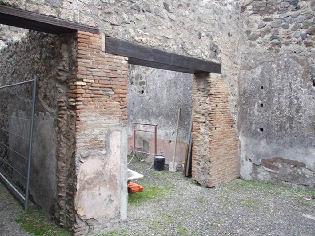 IX.3.19. Taberna T. Genialis. December 2007.  Room 10.  Looking at entrance to room 13 on right, and corridor to bakery on left.