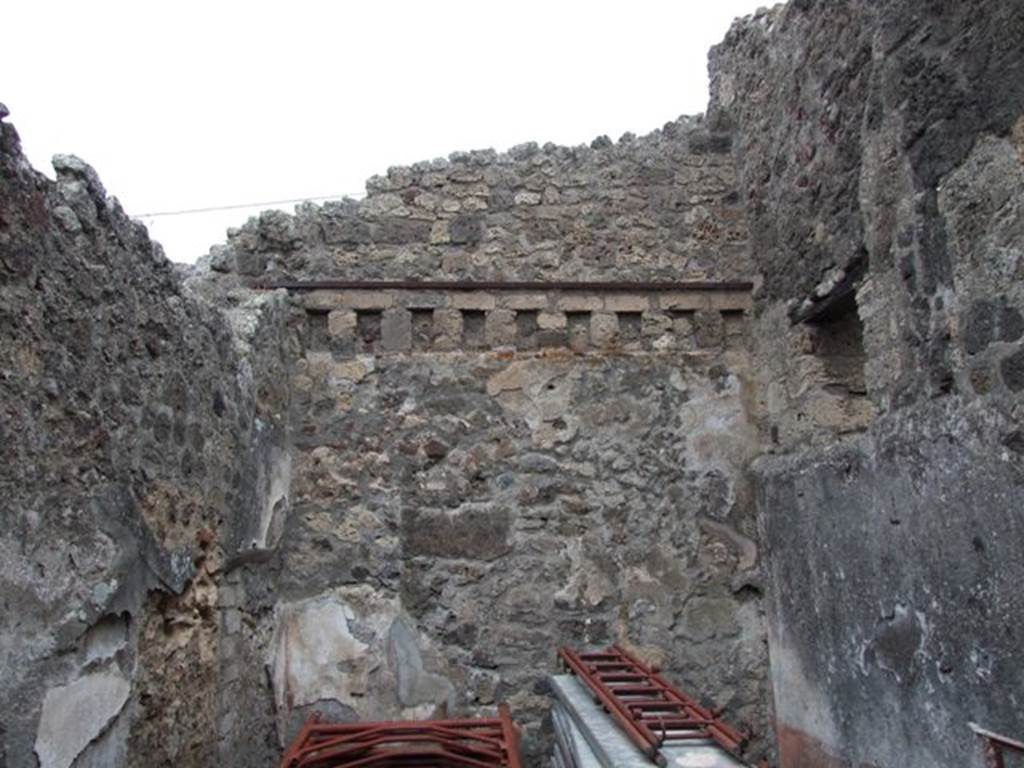 IX.3.19 Pompeii.  December 2007.  Room 13, north wall with holes for the support beams for the upper floor.
