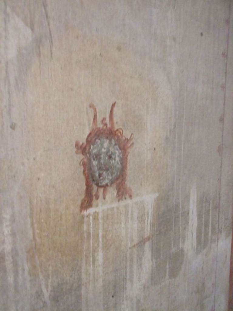 IX.5.6 Pompeii. December 2007. 
Room k�, wall painting of a head or mask from south end in corridor on west wall.  

