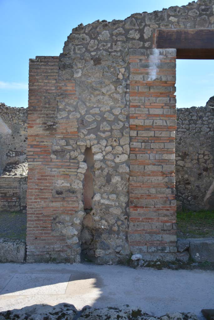 IX.5.8, on left, and IX.5.7, on right, Pompeii. March 2017. 
Looking south to pilaster between two entrance doorways, with terracotta downpipe. 
Foto Christian Beck, ERC Grant 681269 D�COR.

