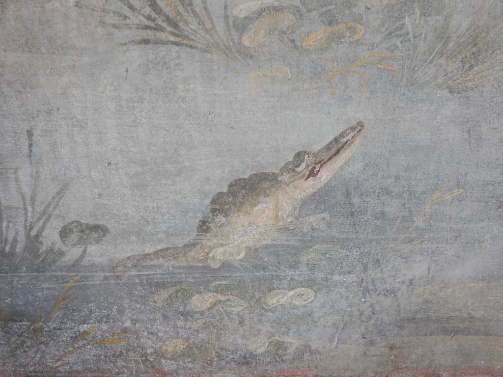IX.5.9 Pompeii. June 2019. Room 8, north wall at east end, detail of the crocodile.
Photo courtesy of Buzz Ferebee.