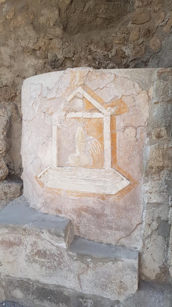 IX.7.1 Pompeii. August 2023. 
Furnace decorated with phallic emblems in stucco. Photo courtesy of Maribel Velasco.
