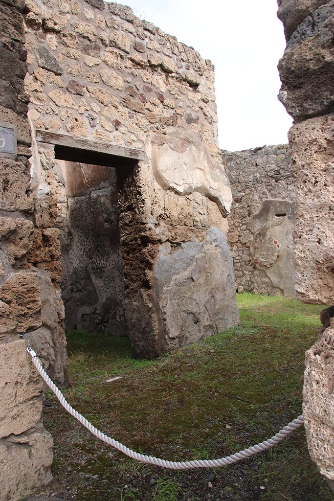 IX.7.19 Pompeii. October 2024. 
Looking east across atrium through entrance doorway, with cubiculum a, on north side of atrium, on left. 
Photo courtesy of Klaus Heese.

