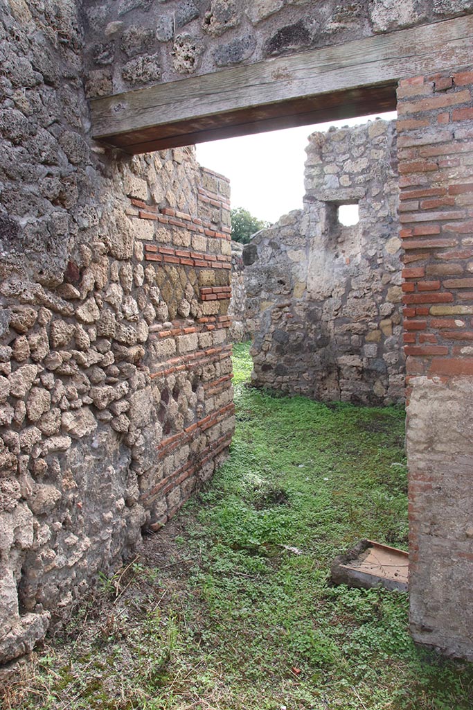 IX.7.19 Pompeii. October 2024. Looking south along corridor f, from atrium. Photo courtesy of Klaus Heese.