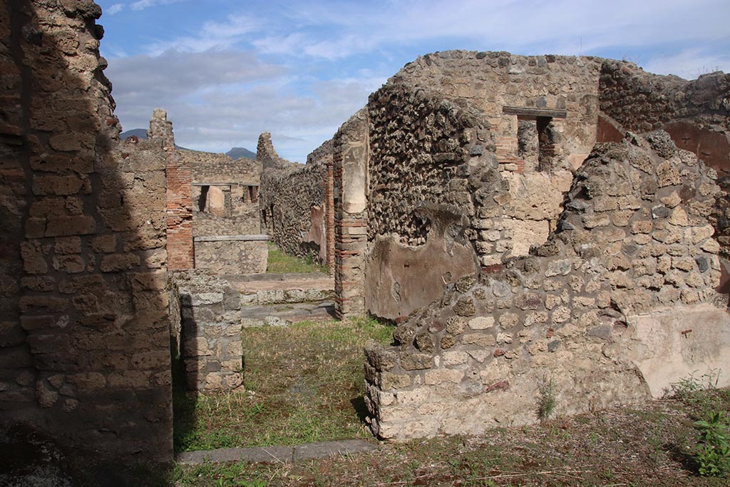 IX.7.21 Pompeii. October 2024. Doorway into IX.7.22 in north wall of atrium at west end. Photo courtesy of Klaus Heese.
