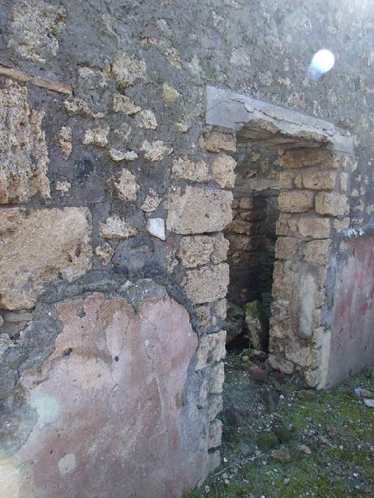 IX.9.13 Pompeii. March 2009. Doorway to Room 7. Small room or cupboard.