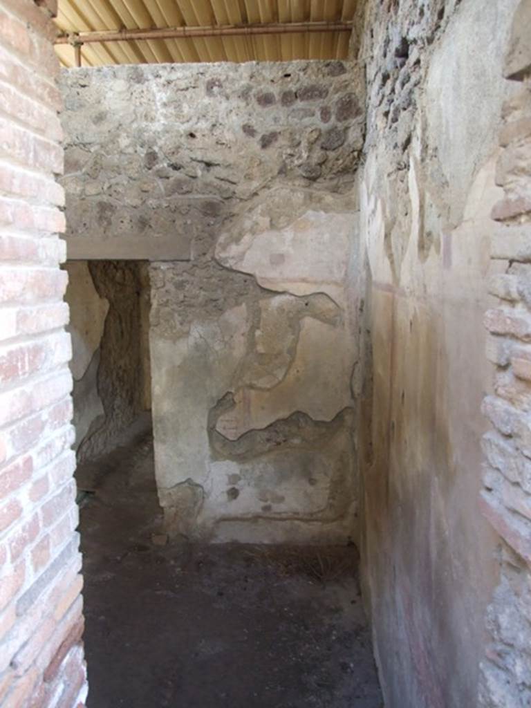 IX.9.c Pompeii. March 2009. Looking west into anteroom leading to small room or cupboard.
According to NdS, these could have both been described as cubiculae.

