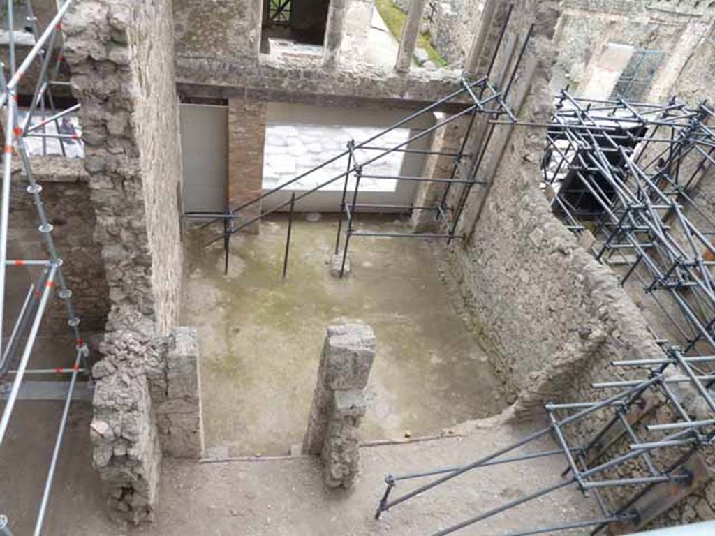 IX.12.2 Pompeii, stairs to upper floor, on left, and IX.12.1, in centre. May 2010. Looking south from above rear rooms “b” and “c”. 

