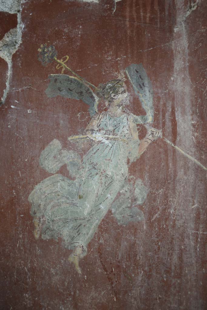IX.12.6 Pompeii. February 2017.
Room “m”, detail of flying figure at north end of east wall in north-east corner.
Photo courtesy of Johannes Eber.