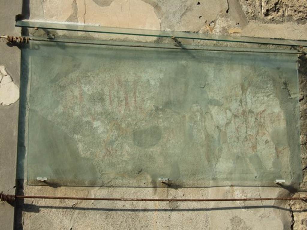 IX.13.1 Pompeii. December 2007. Graffito on the east side of entrance doorway, CIL IV 7944 and CIL IV 7950. According to Varone and Stefani, found on the east side of the doorway were CIL IV 7942, 7944, 7945 and 7946. Further to the east of CIL IV 7944, was CIL IV 7950, which is now unreadable. Only part of CIL IV 7944 and CIL IV 7950 remains visible, see above photo. See Varone, A. and Stefani, G., 2009. Titulorum Pictorum Pompeianorum, Rome: L’erma di Bretschneider, (p.463-4)
According to Epigraphik-Datenbank Clauss/Slaby (See www.manfredclauss.de), these read as –
A(ulum)  Rustium  Verum 
d(uumvirum)  i(ure)  d(icundo)  Polybi(us)  collega  fac(iat)  [CIL IV 7942]
Paquium 
et  Capr[as]ium  [IIvir(um)]   i(ure)  d(icundo)  o(ro)  v(os)  f(aciatis)       [CIL IV 7944]
Severum  aed(ilem) 
Polybius  rogat         [CIL IV 7945]
v(irum)] 
p(robum)  o(ro)  v(os)  f(aciatis)  dignissium       [CIL IV 7946]
Ampliatum 
aed(ilem)  o(ro)  v(os)  f(aciatis)       [CIL IV 7950]


