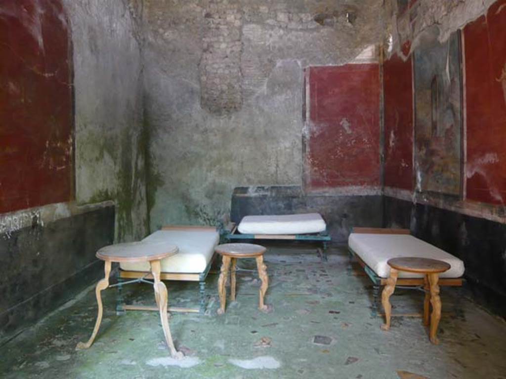 IX.13.1-3 Pompeii. May 2012. Room 13, with reproduction dining furniture, looking north. Photo courtesy of Buzz Ferebee.
