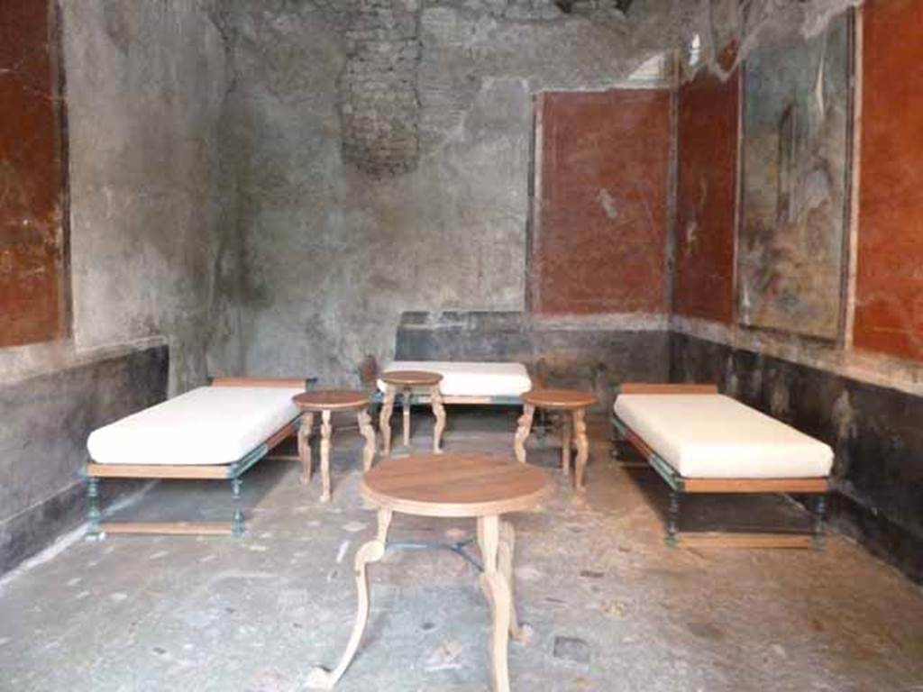 IX.13.1-3 Pompeii. May 2010.  Room 13, with reproduction dining furniture, looking north.