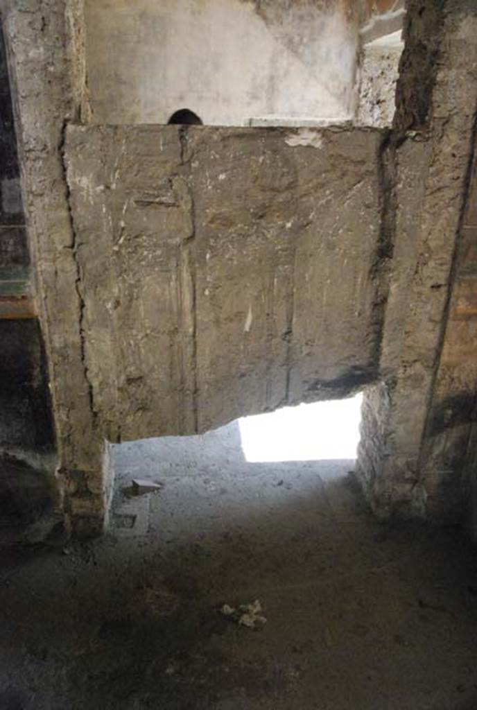 IX.13.1-3 Pompeii. October 2007. Room 13, plaster cast of door at south end of east wall. Photo courtesy of Nicolas Monteix.
