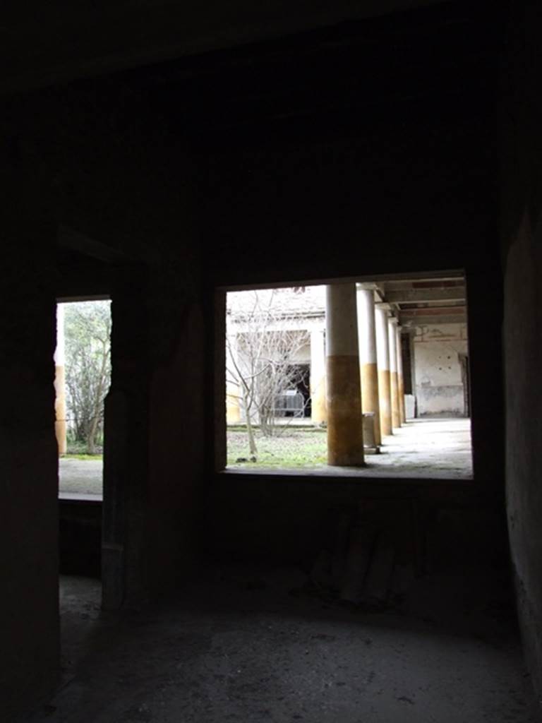 IX.13.1-3 Pompeii. March 2009. Room 14, looking north through window to east side of peristyle.