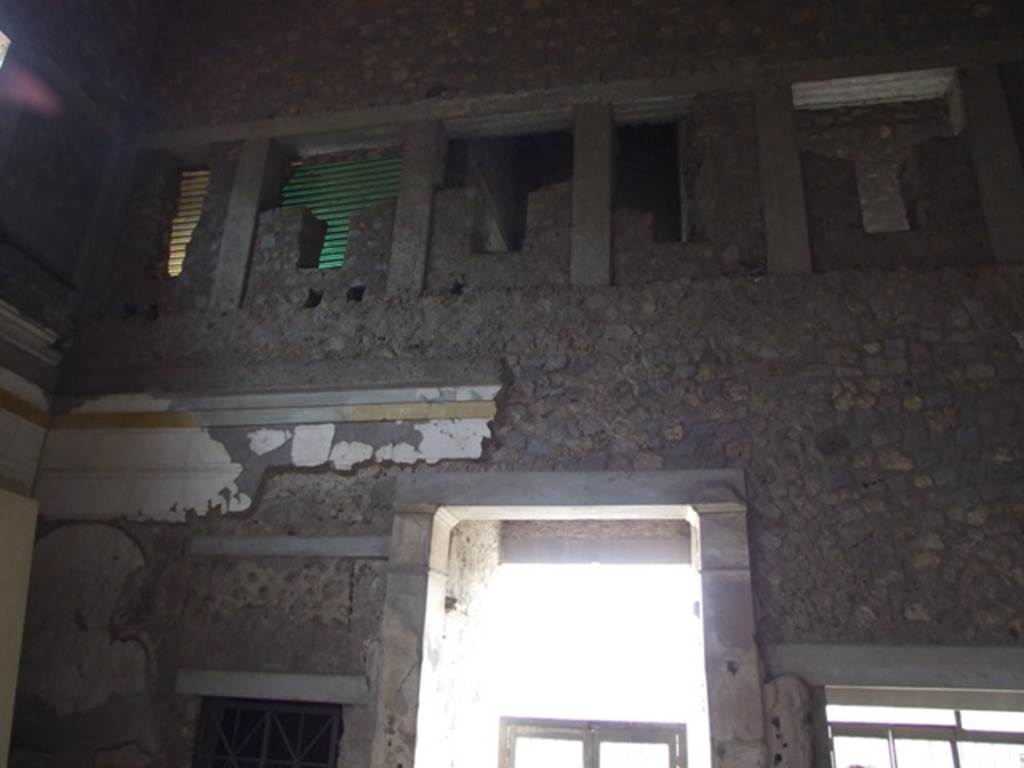 IX.13.1-3 Pompeii. March 2009. Room 1, upper south wall. Doorways of IX.13.3 and IX.13.2.