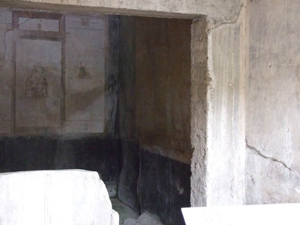 IX.13.1-3 Pompeii. March 2009. Room 12, north-east corner, with wall painting in centre of north wall.