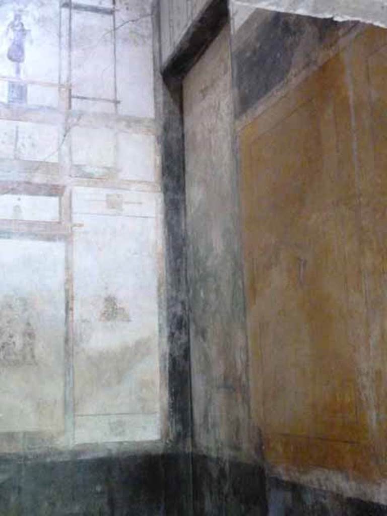 IX.13.1-3 Pompeii. May 2010.  Room 12, north east corner. According to Wilhelmina, a similar painting to that on the north-west side was also seen on the north-east side, but was not in a good state.
