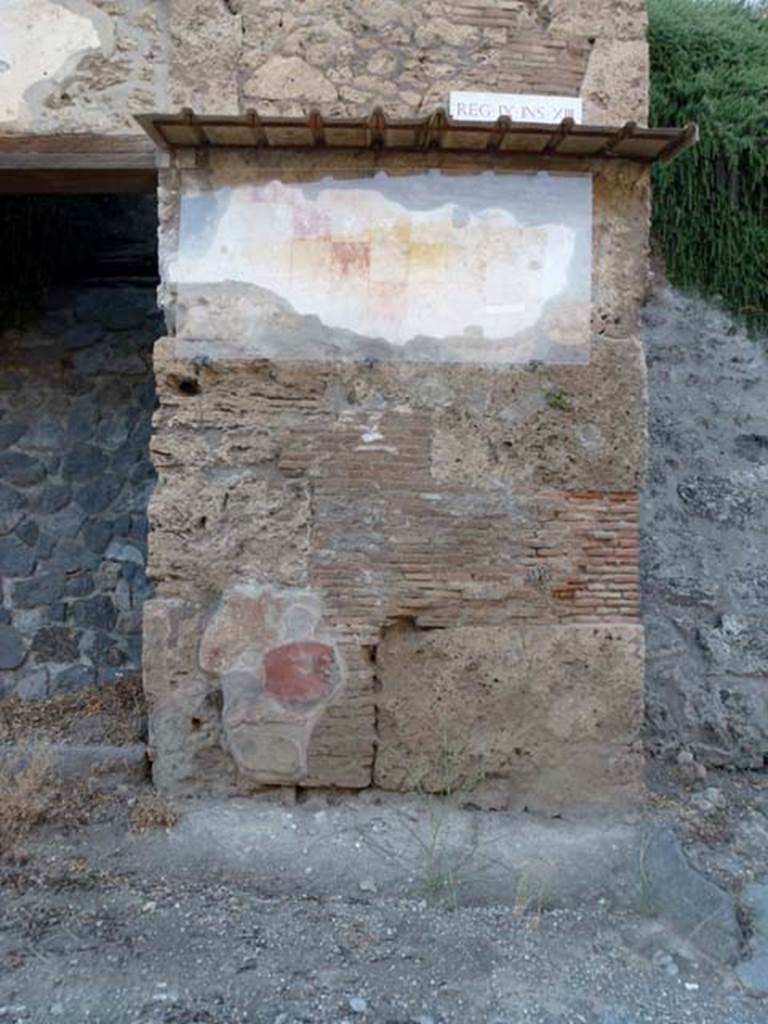 IX.13.6 Pompeii. June 2012. Painted plaster with chessboard pattern to east of entrance.
Photo courtesy of Michael Binns.
