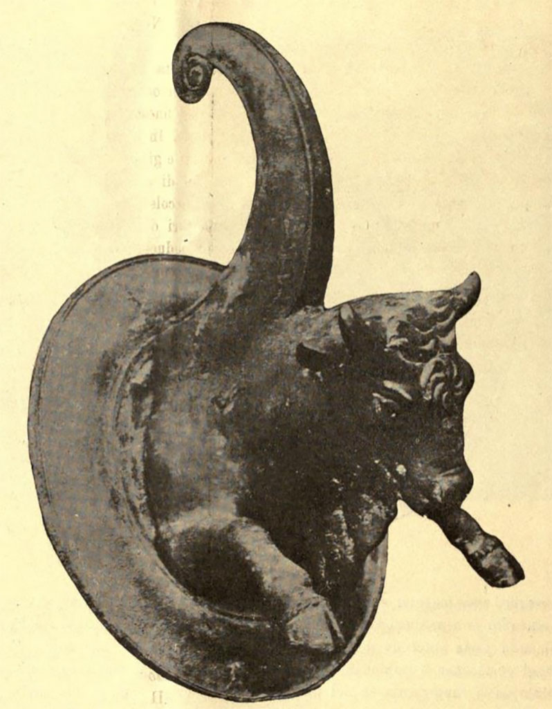 IX.14.4 Pompeii. One of another pair of bronze fitting (borchia figurata), from south wall of atrium B.
See Notizie degli Scavi di Antichità, 1905, (p.256 fig.8)
