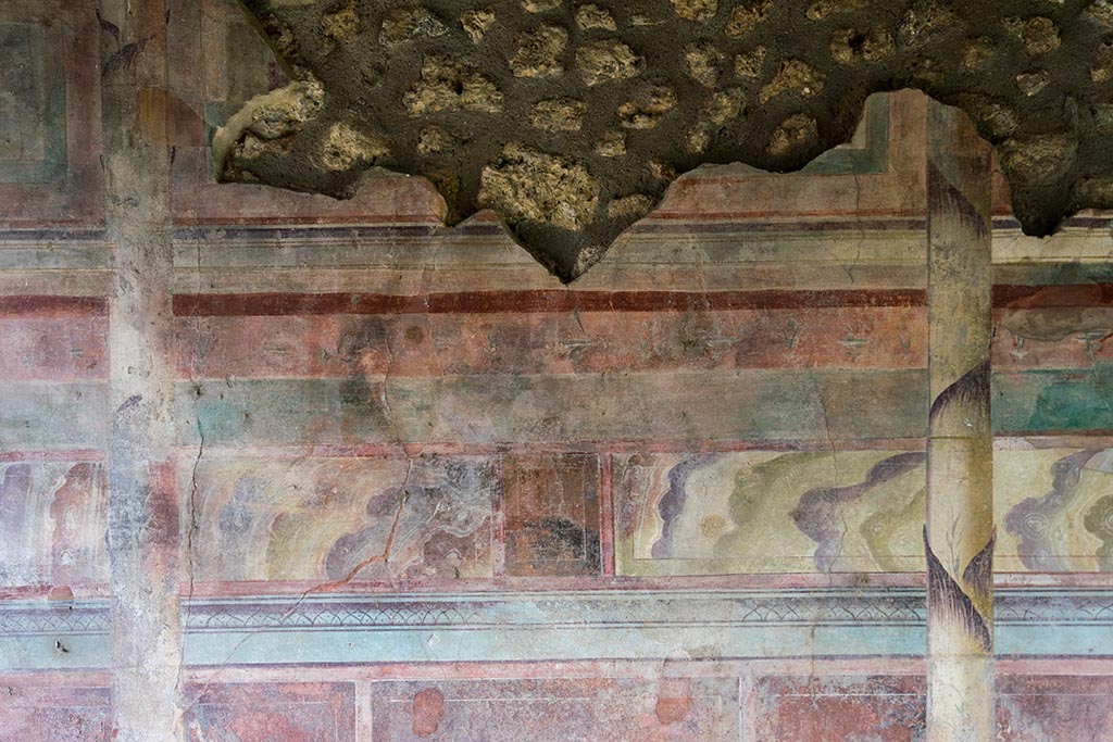 IX.14.4 Pompeii. July 2024. Tablinum, detail from upper centre of east wall. Photo courtesy of Johannes Eber.