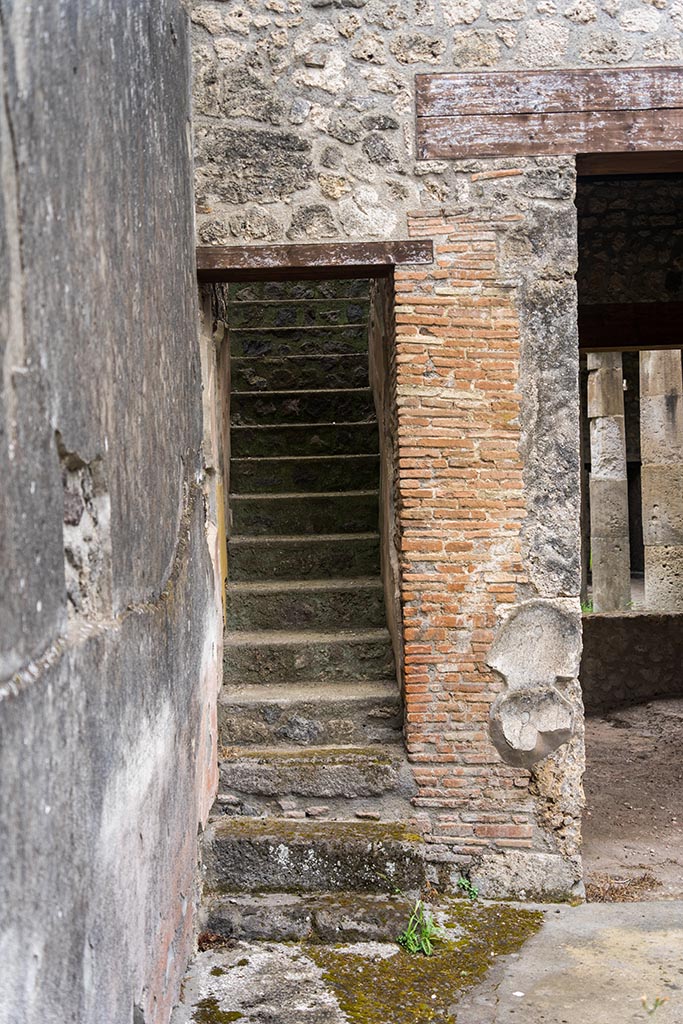 IX.14.4 Pompeii. July 2024.
Staircase on south-east side of room 27, the atrium of IX.14.2. Photo courtesy of Johannes Eber.
