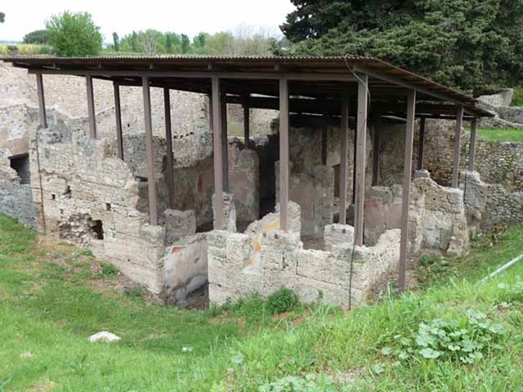 IX.14.c Pompeii. May 2010. Looking north-east. According to Spano, the construction of this house was very old. Its fa�ade was formed entirely from large blocks of Sarno limestone. See Notizie degli Scavi di Antichit�, 1911, p. 374.