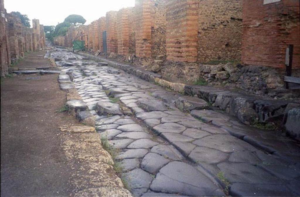 Via Stabiana, July 2011. 
Looking north towards Vicolo del Panettiere, on left, and IX.4, on right, from near junction with unnamed vicolo between IX.4 and IX.3. 
Photo courtesy of Rick Bauer.
