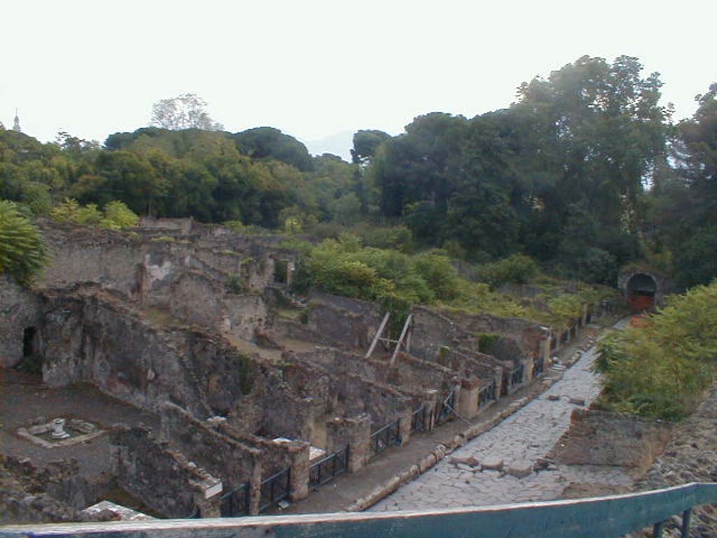 Via Stabiana, east side, I.2.10 on left, to I.1.1 at the Stabian Gate. May 2005.
Looking south towards the Stabian Gate from the top of the Little Theatre. 
