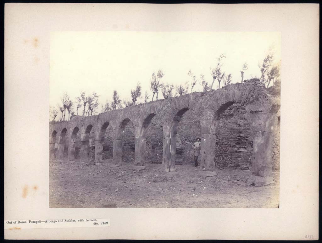 Via dei Sepolcri, east side. 1869-1877. Photo titled "Pompeii - Albergo and stables with arcade".
Photo © British School at Rome, Parker Collection, call number JHP[PHP]-2159. CC BY-NC-ND 4.0