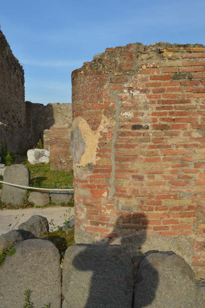 Via del Foro, east side, Pompeii. March 2019. 
Looking east towards base of pilaster/column at northern end.
Foto Taylor Lauritsen, ERC Grant 681269 D�COR.
