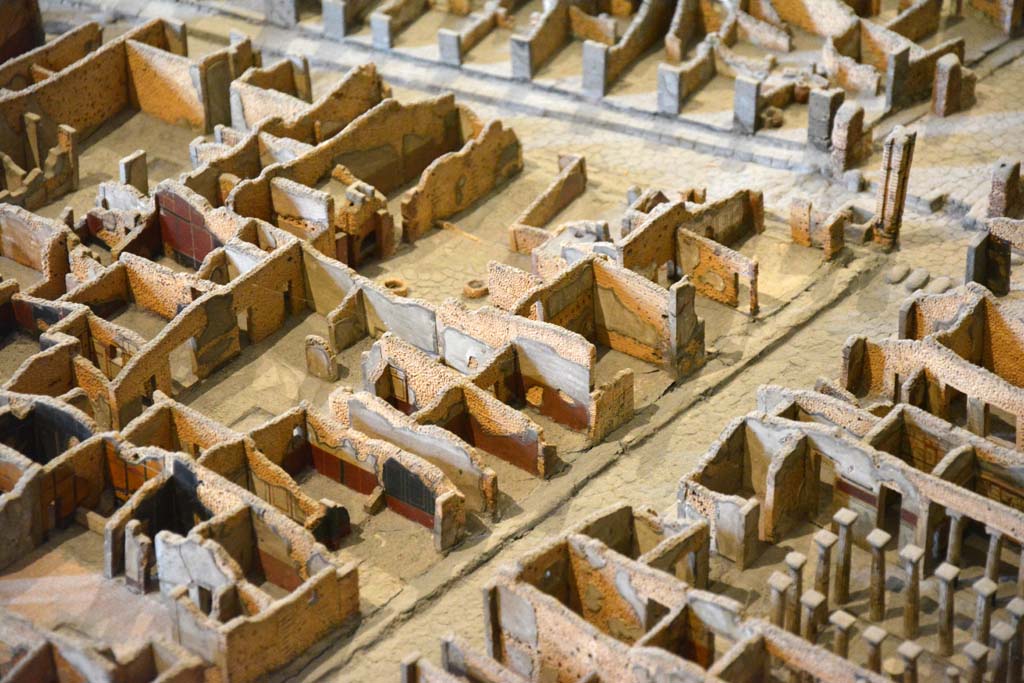 Via dell’Abbondanza, south side, Pompeii. May 2019. 
Looking towards west end of Insula I.4, with I.4.16, next to fountain and water-tower at junction with Via Stabiana, on right.
Foto Tobias Busen, ERC Grant 681269 DÉCOR.
