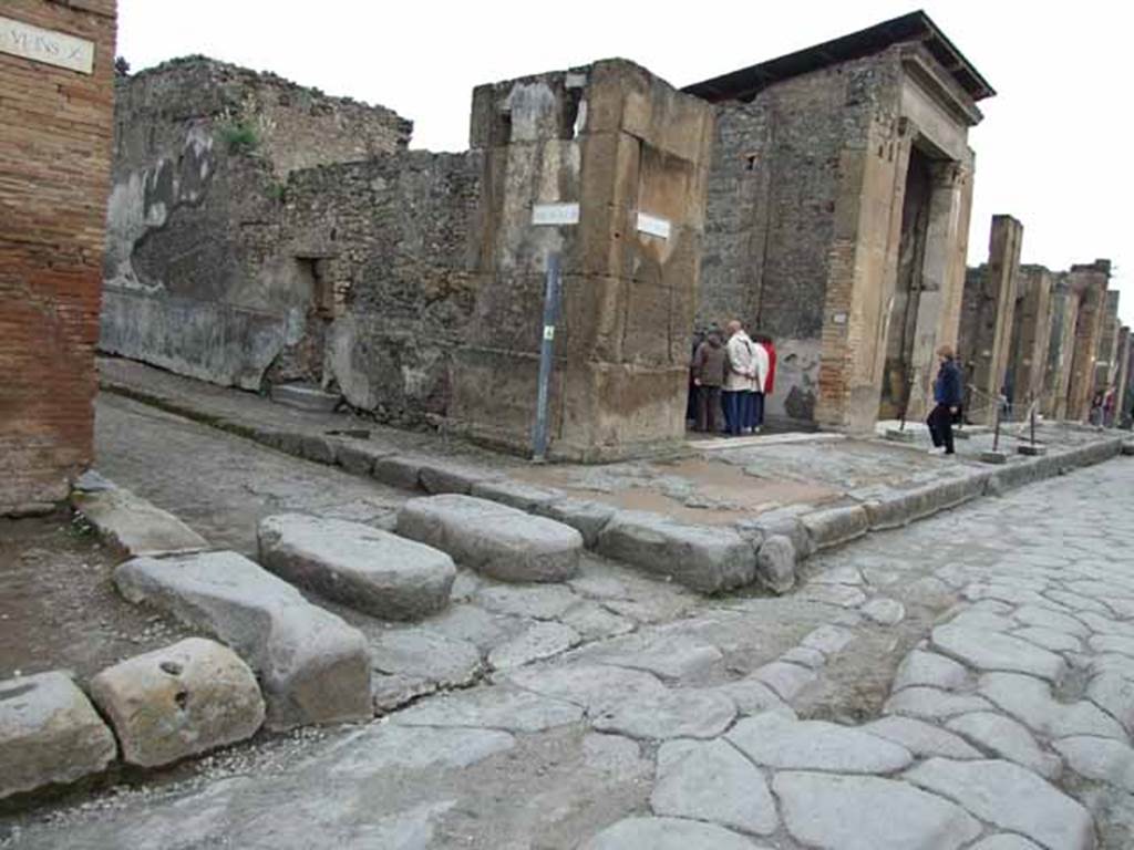 Via della Fortuna, north side, May 2010. Junction with Vicolo del Fauno, between VI.10 and VI.12.