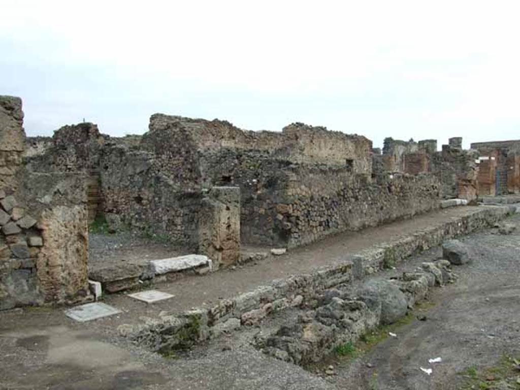 Via delle Terme, north side. May 2010.  Looking east along VI.4.