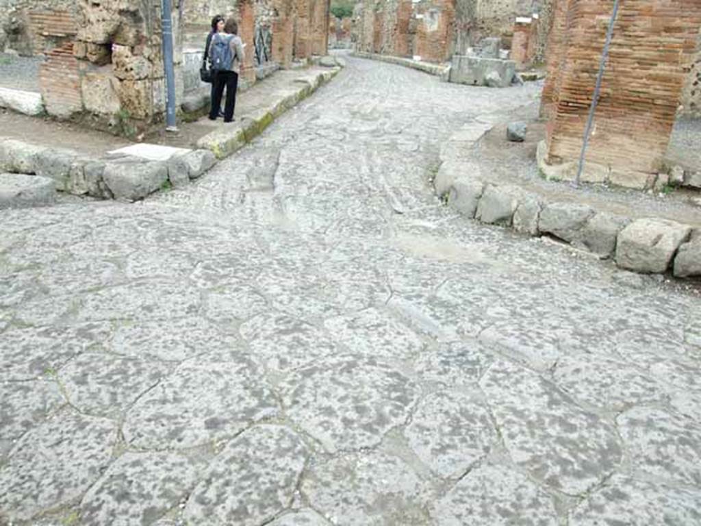 Via delle Terme. May 2010. Looking north at wheel rut wear at junction with Via Consolare.
