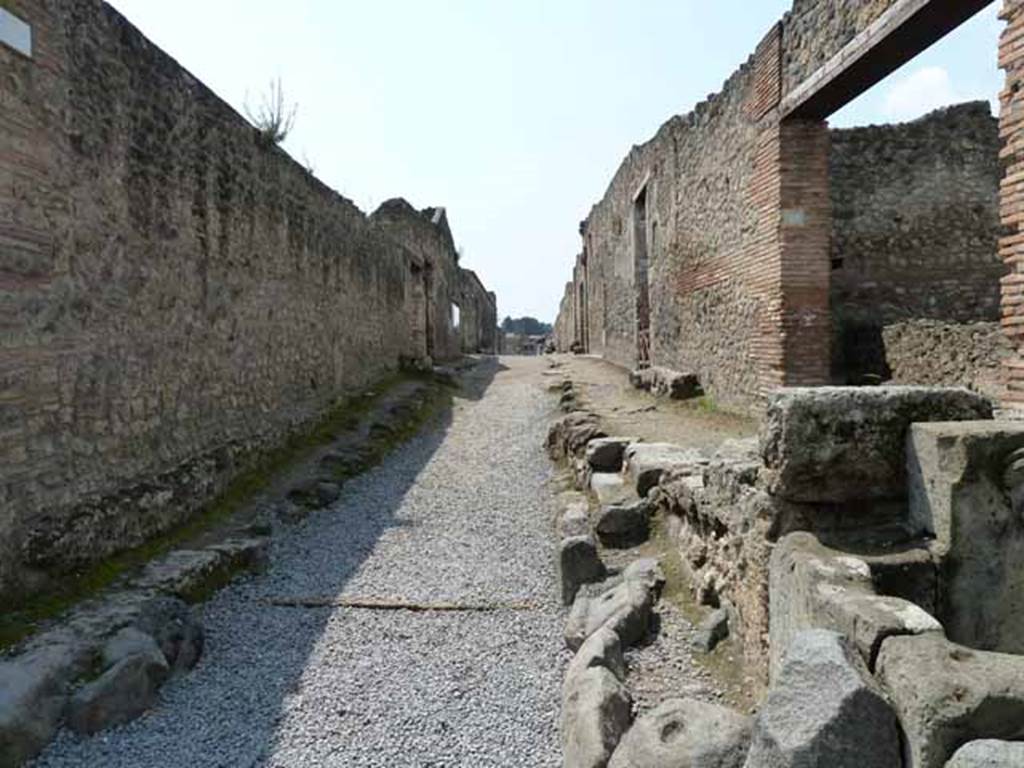 Via di Castricio, May 2010. Looking west between I.14 and I.13, from junction with Via di Nocera.